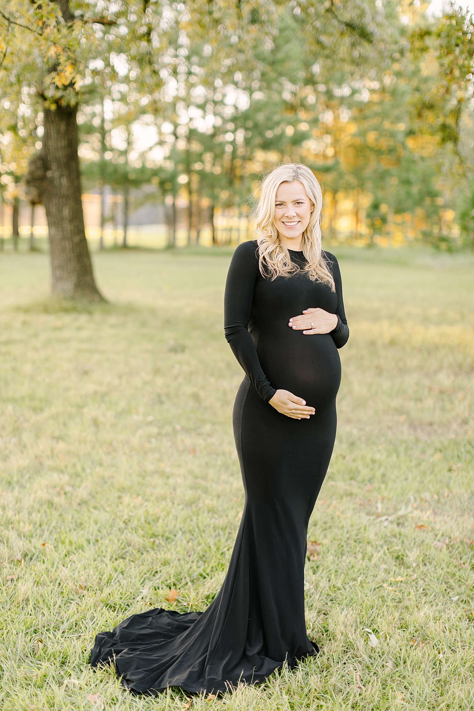 expecting mom in black dress captured by houston maternity photographer