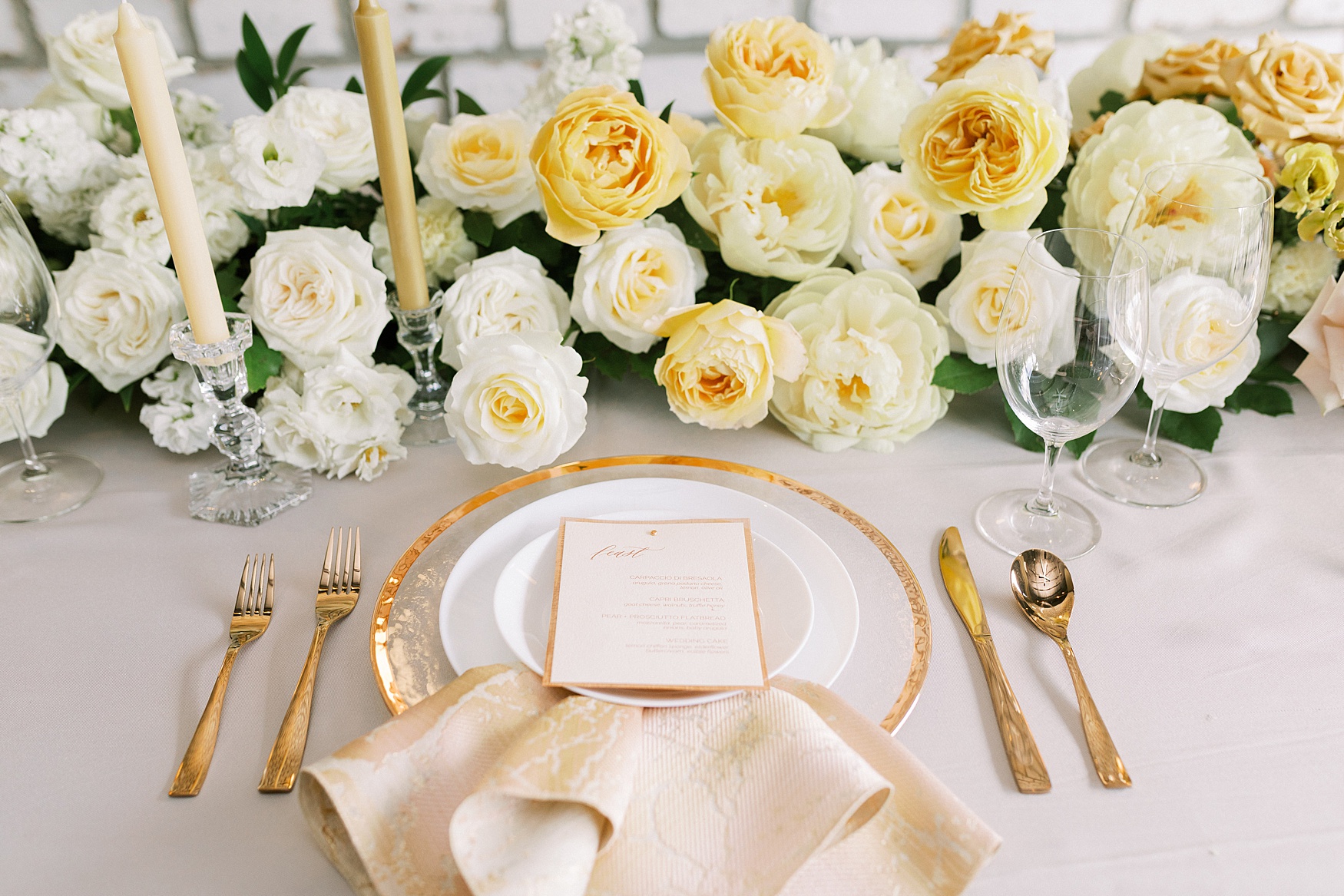 Pride wedding editorial tablescape with yellow roses